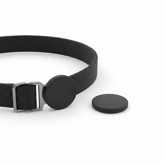 Ultra compact GPS pet tracker, coin-sized, attached to a pet collar